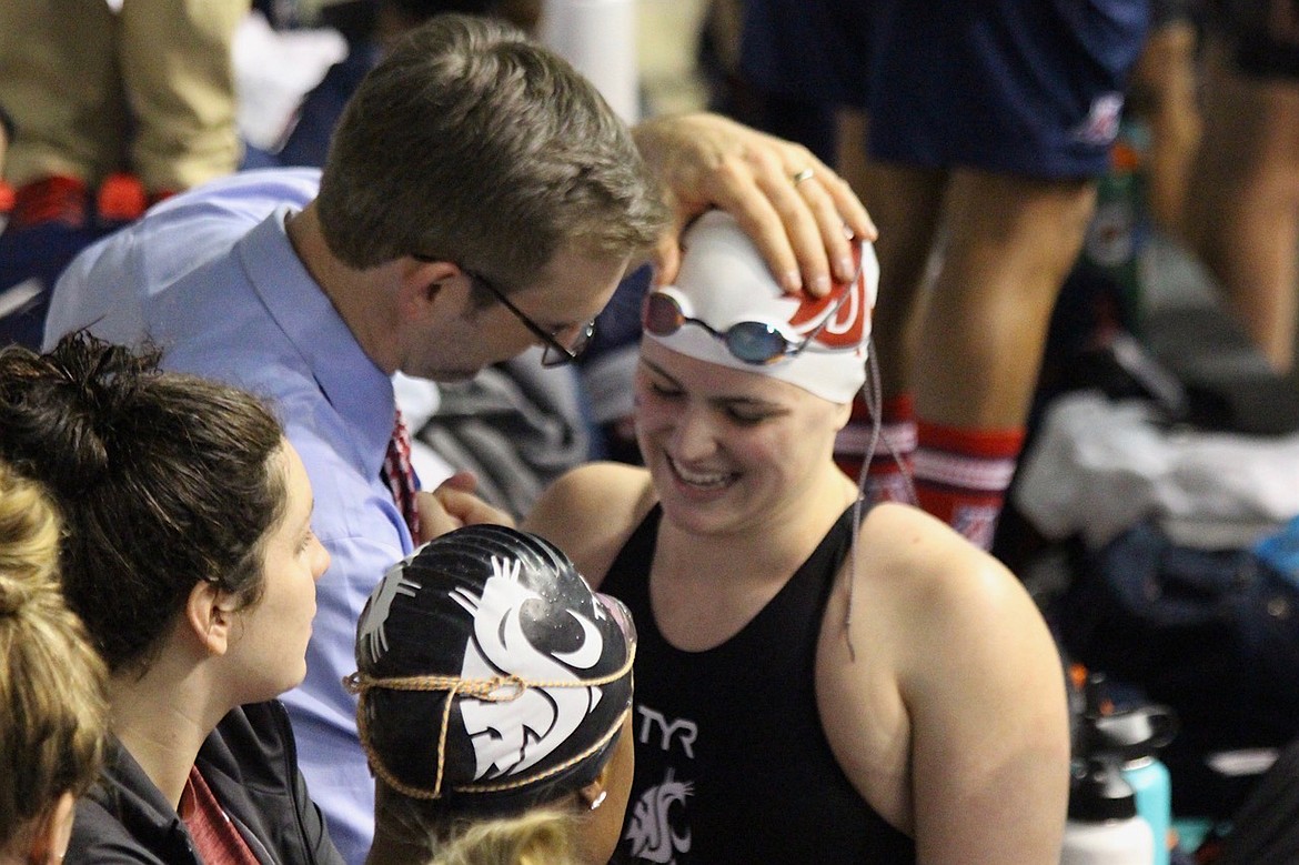 (Photo courtesy of JACINDA BOKOWY)
Payton Bokowy smiles while talking to head coach Matt Leach after getting out of the pool at the Pac-12 Championships this season.