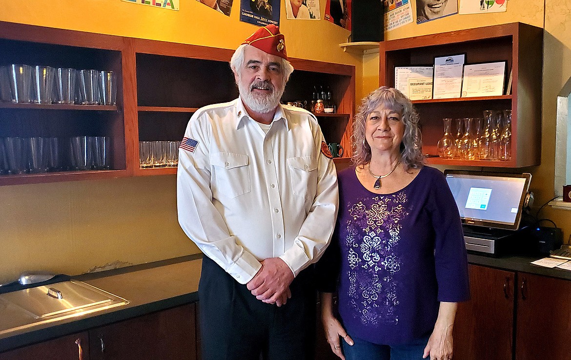 Commandant Robert Crader and Lisa Arlo Guscott at Arlos Restaurant.