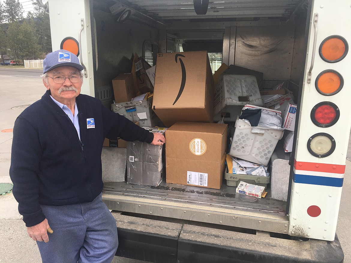 BILL BULEY/Press 
 Jim Mathe's Postal Service truck t is packed with packages and envelopes to be delivered in in Coeur d'Alene on Monday.