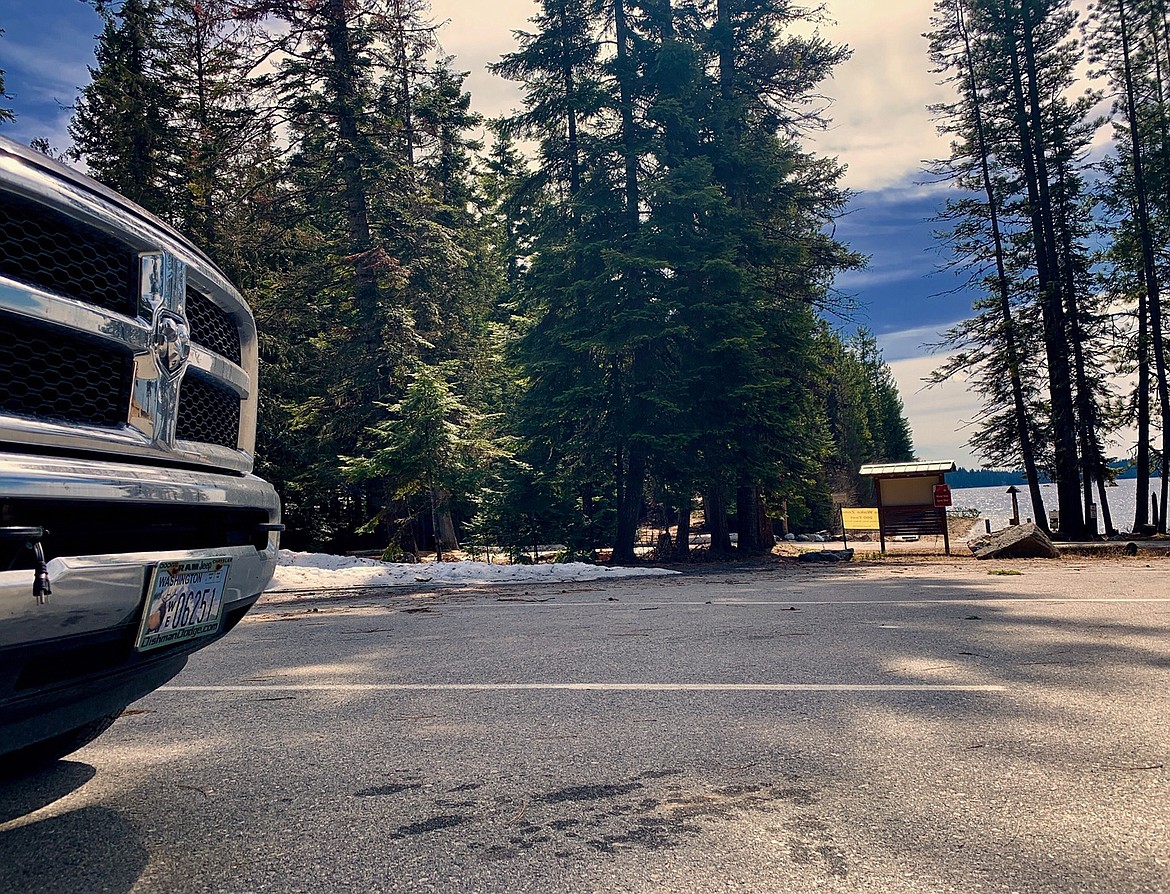 Idaho state park day-use areas — packed full over the weekend — thinned out by Tuesday when this picture was taken at Priest Lake State Park. Park managers in North Idaho say the number of vehicles since COVID-19 restrictions were put in place last month has doubled the use of state parks, with most of the visitors coming from out of state.