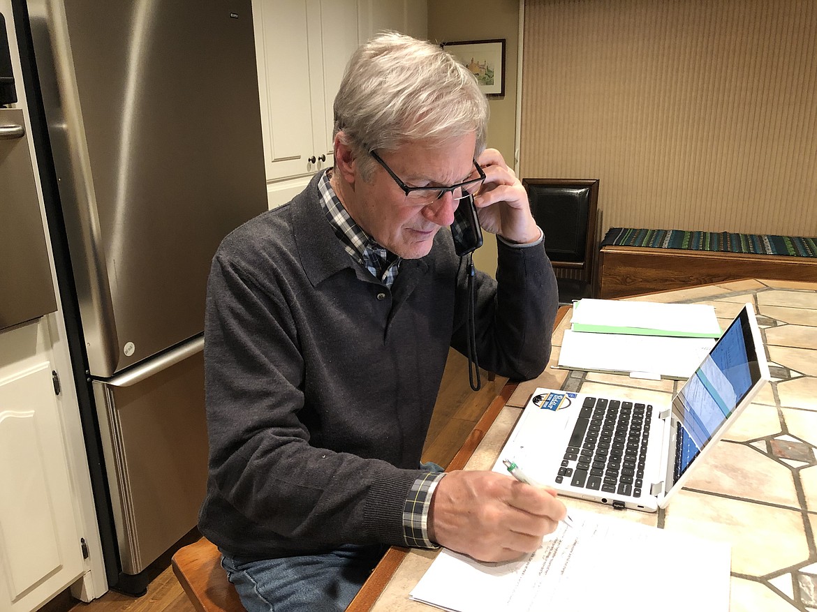 CDAIDE volunteer Steve Moss takes a call on Wednesday to help a struggling service industry worker. Through referrals from employers and co-workers, CDAIDE works to connect hospitality and restaurant employees with funding and resources to help them through tough times. Weekly referrals have increased 2,500 percent since the outbreak. (Courtesy photo)