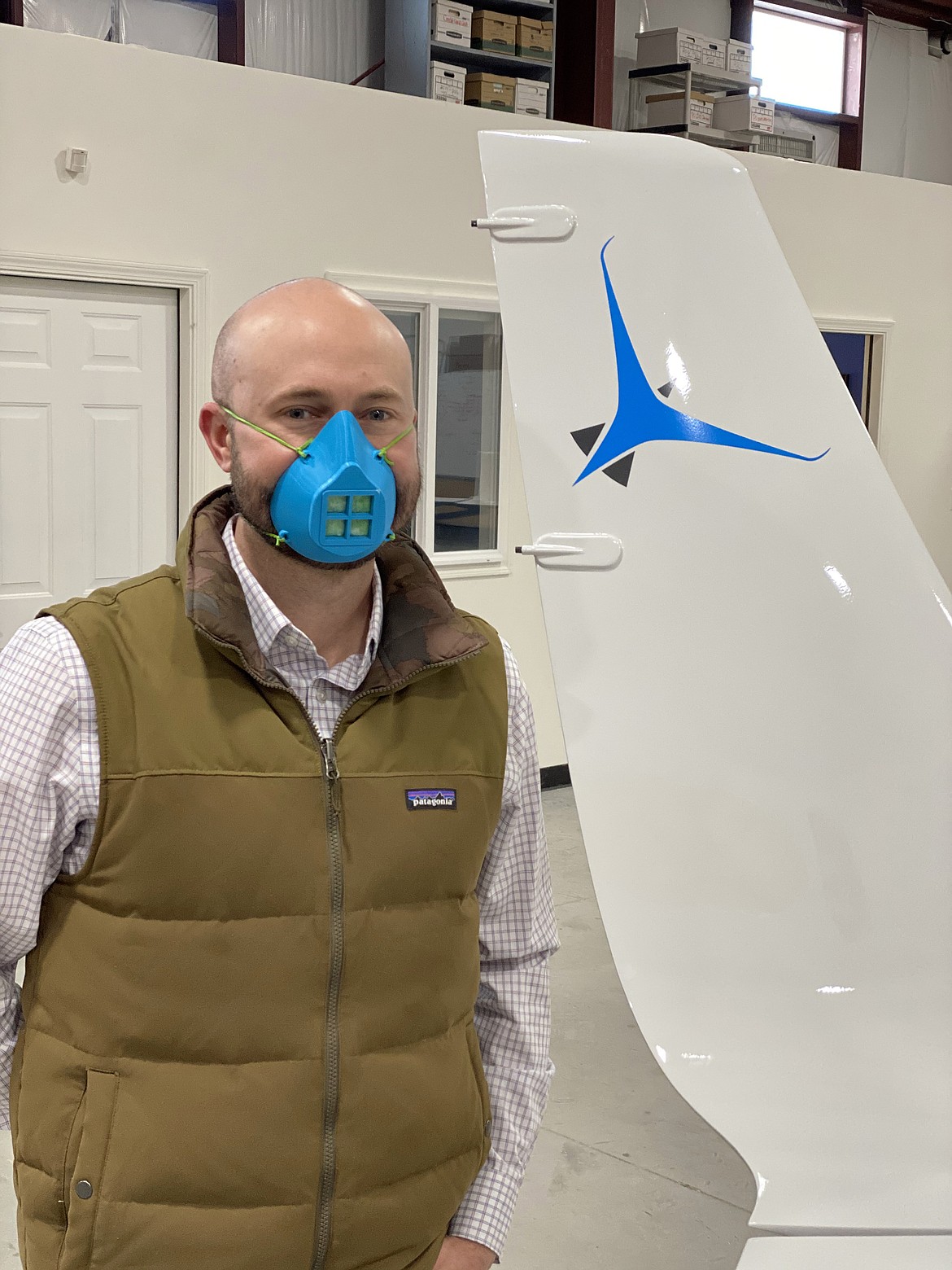 (Photo courtesy TAMARACK AEROSPACE) 
 Tamarack Aerospace chief engineer Nathan Cropper models a reusable mask, that with a replaceable filter, is the equivalent to an N95 mask. The Sandpoint company, which makes active winglets, is making the masks to donate to Bonner General Health.