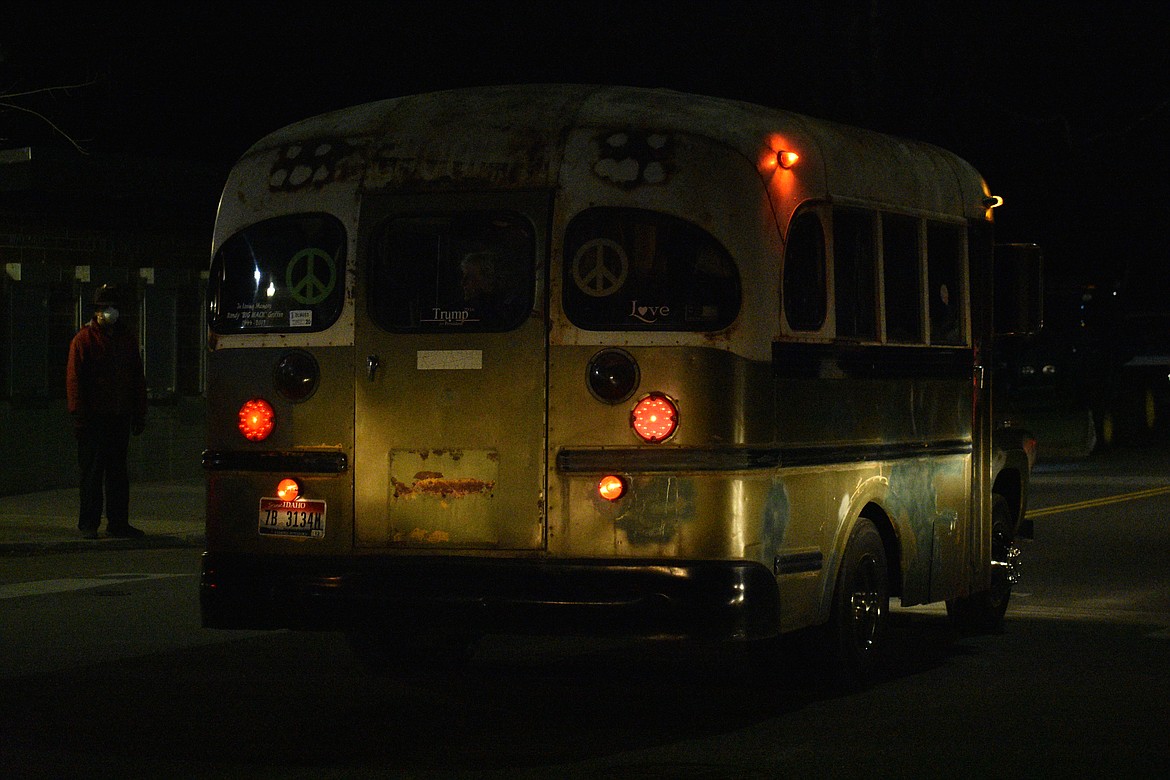 (Photo by DYLAN GREENE) 
 A retro bus cruises down Ontario Street during the "Be the Light" celebration Friday night at War Memorial Field.