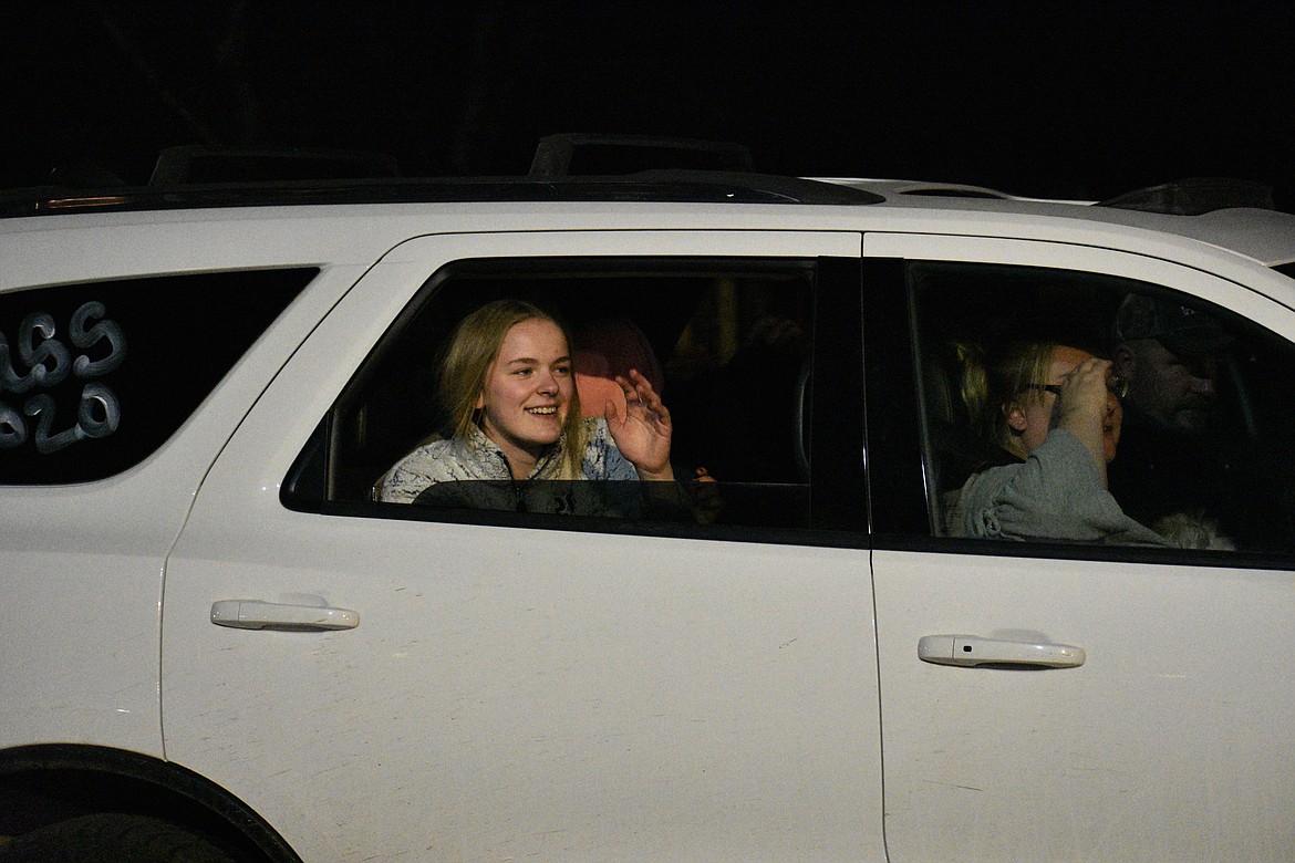 (Photo by DYLAN GREENE) 
 SHS students, families and seniors parade down Ontario Street on Friday night.