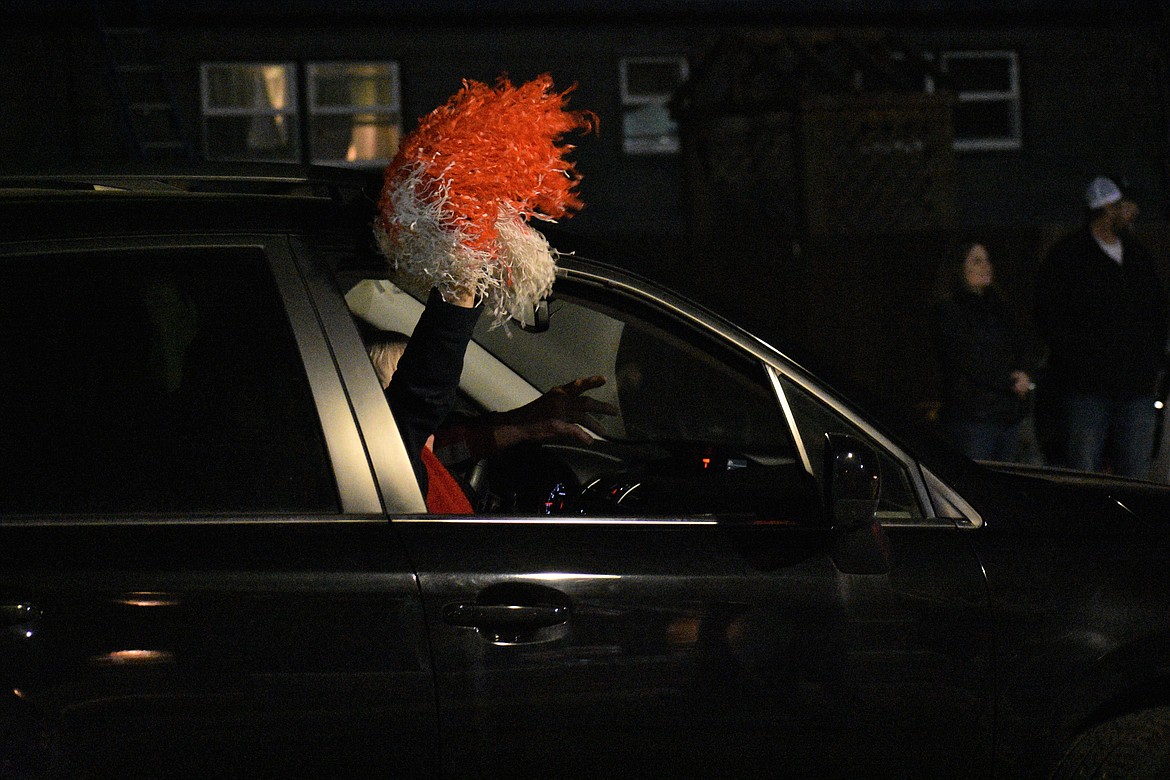 (Photo by DYLAN GREENE) 
 SHS students, families and seniors parade down Ontario Street on Friday night.