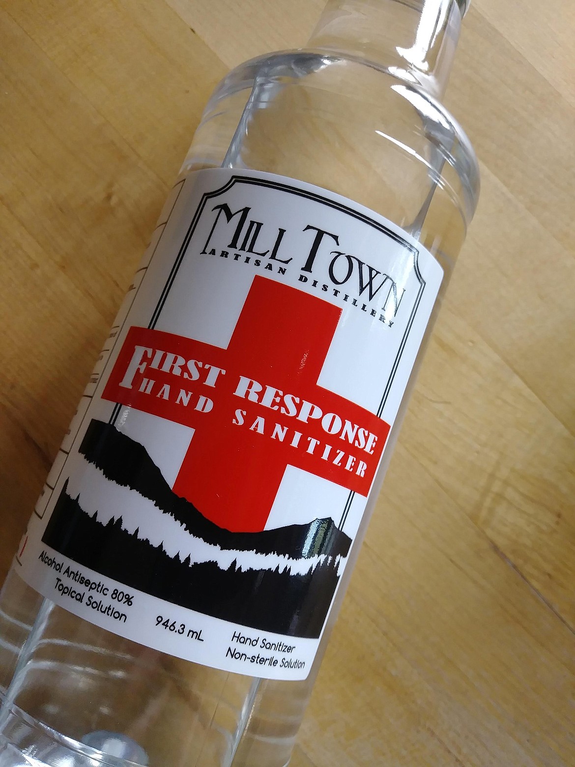 (Photo courtesy MILL TOWN DISTILLERY) 
 A bottle from the first batch of hand sanitizer that Mill Town Distillery made to help meet the local demand for the much-needed product. In addition to selling the hand sanitizer at a discount to first responders, the distillery also is making sure that local emergency service agencies have enough to meet their needs.