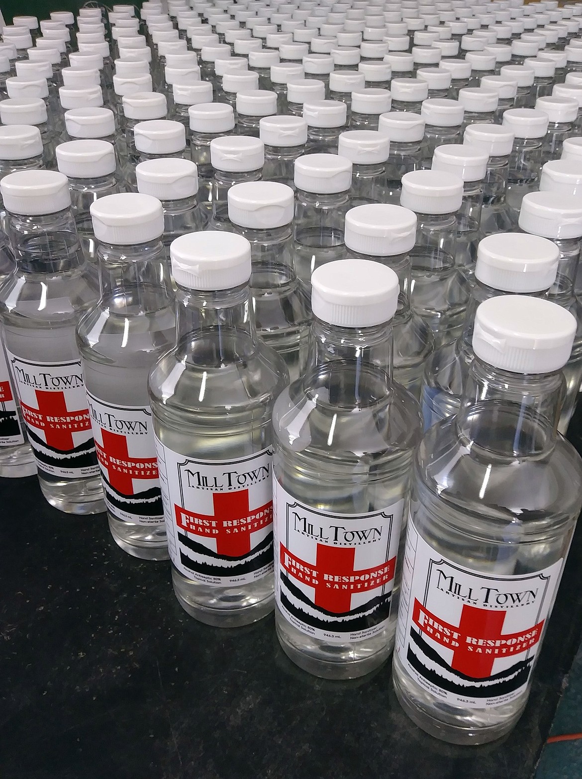 (Photo courtesy MILL TOWN DISTILLERY) 
 A few of the more than 6 dozen bottles of hand sanitizer that Mill Town Distillery made to help meet the local demand for the much-needed product. In addition to selling the hand sanitizer at a discount to first responders, the distillery also is making sure that local emergency service agencies have enough to meet their needs.