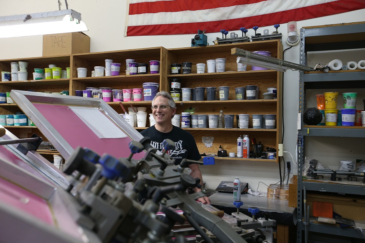 Greg Parker is the master printer at Atomic Threads.