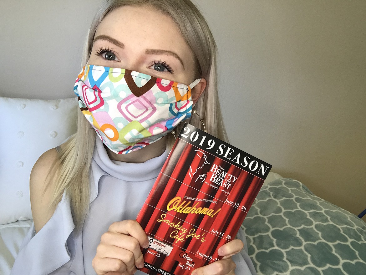 Actress Ellie (Elizabeth) Cook poses with her mask donations. She is donating the proceeds to Coeur d’Alene Summer Theatre.