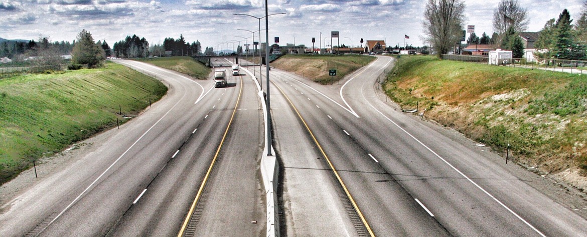 Looking west from the Government Way bridge, Interstate 90 traffic was sparse around noon Tuesday. Traffic numbers that declined by half last month after Gov. Brad Little issued a stay-at-home order are creeping back up, especially in North Idaho. 
 (RALPH BARTHOLDT/Press)