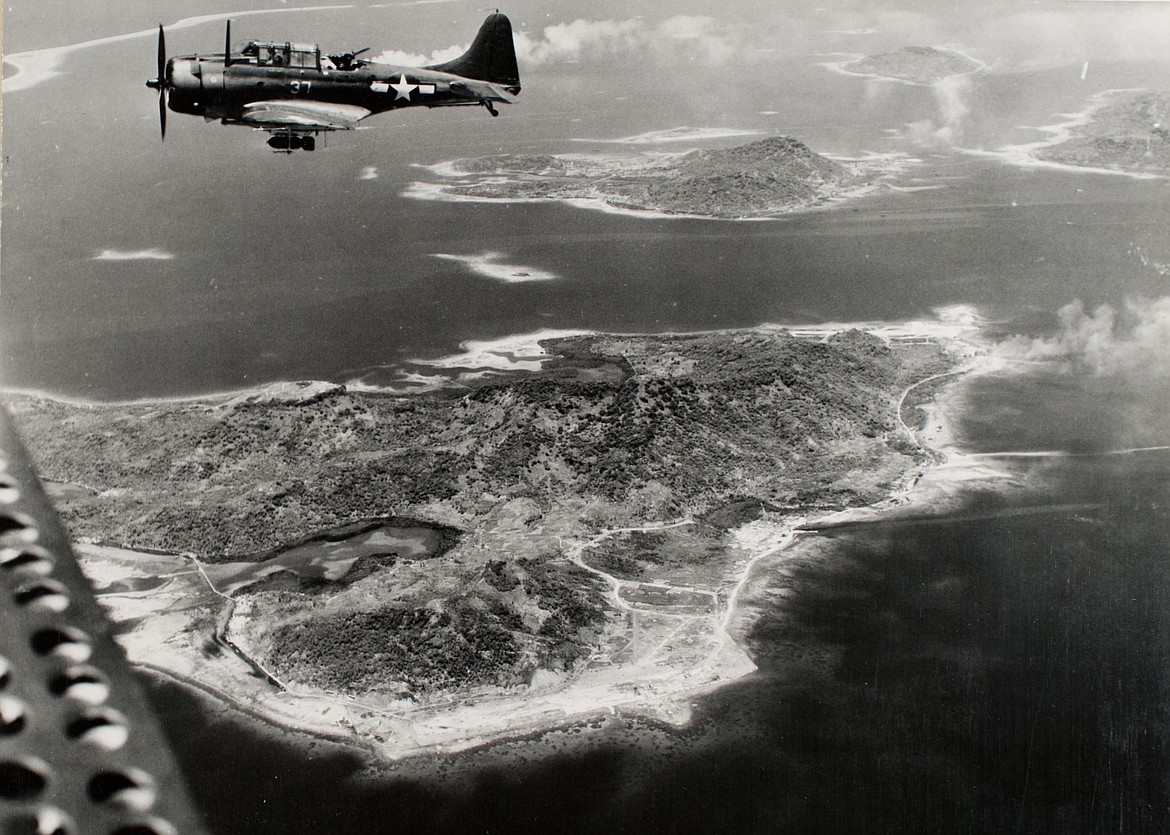 U.S NAVY 
 Navy Dauntless fighter over Truk Lagoon (1944).