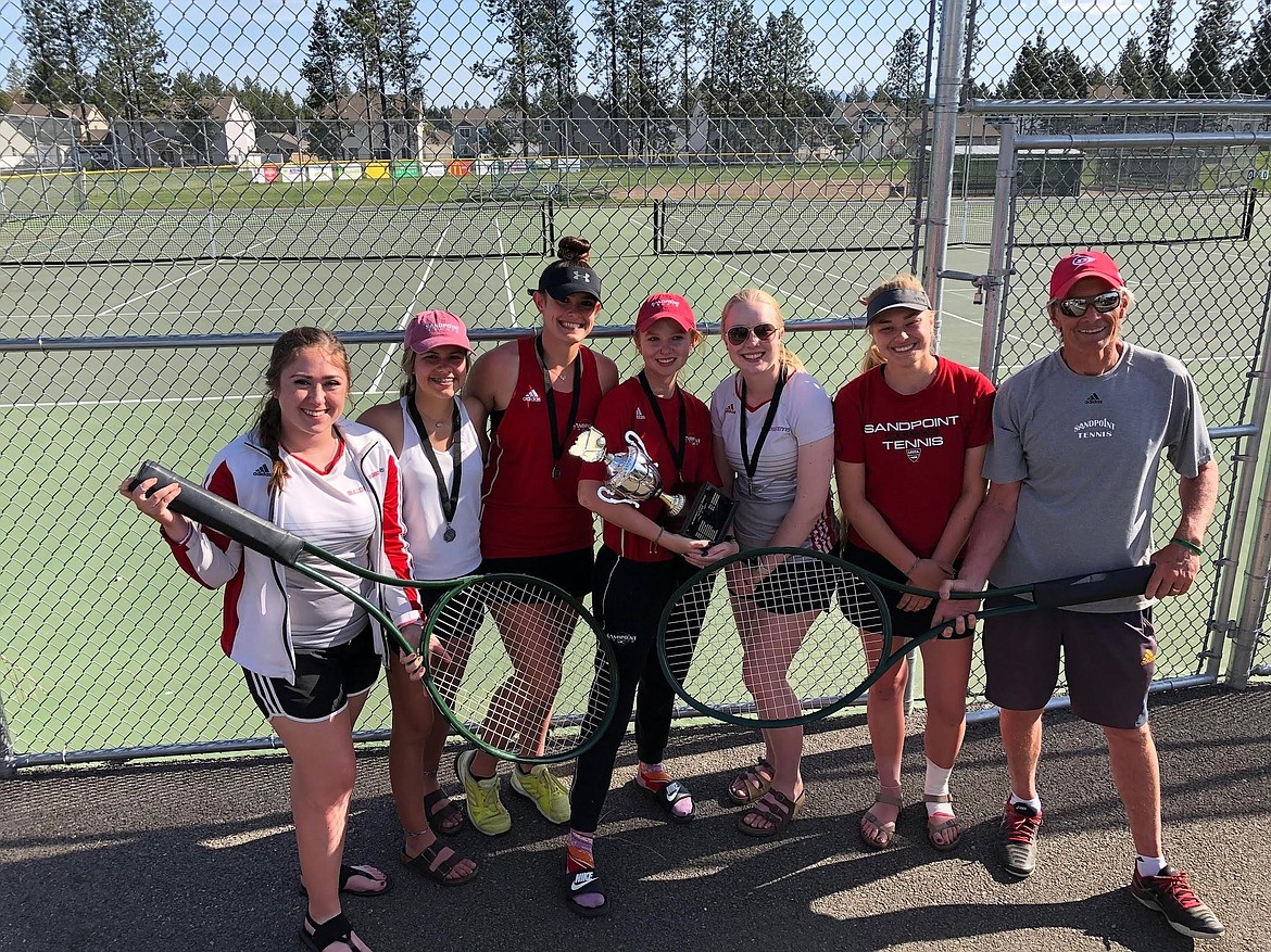 (Photo courtesy of TIFFANY GOODVIN) 
 Hadley Goodvin poses with her teammates after the Sandpoint tennis team won the district championship trophy last year.