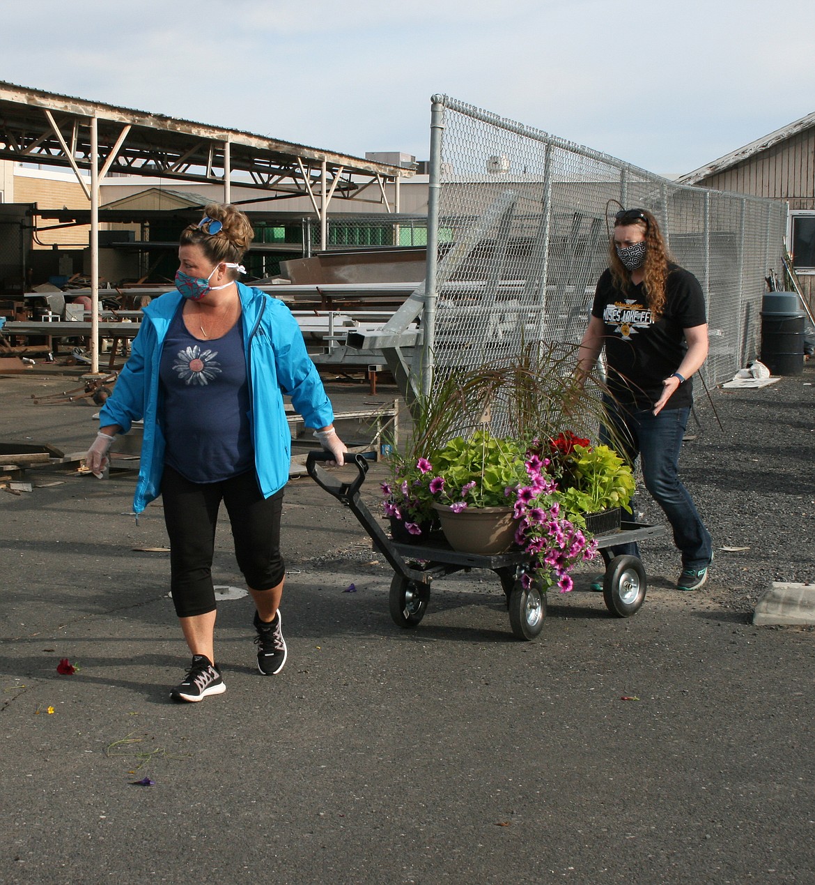 Cheryl Schweizer/Columbia Basin Herald 
  
 Gardeners left the Moses Lake High School greenhouse Friday with a head start on summer planting. The annual FFA plant sale sold out in less than six hours.