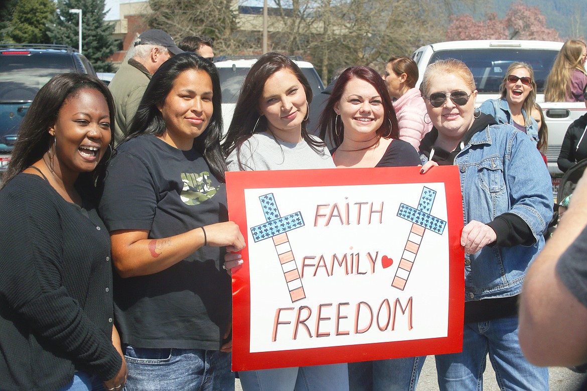 BILL BULEY/Press 
 Five women who attended Sunday's freedom rally in Coeur d'Alene include, from left, Isata Williams, Chantell Talksdifferent, Ashley Shafer, Haley Brinkley and Stacy Dudley.
