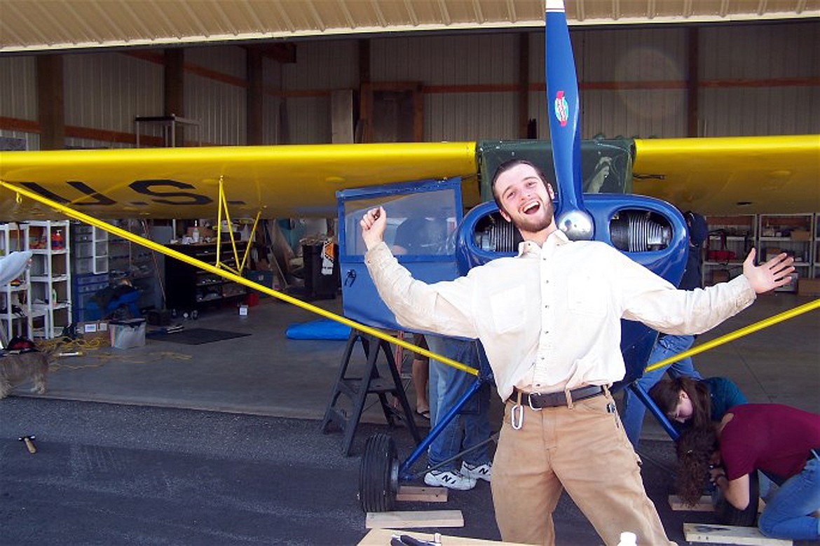 (Courtesy photo) 
 Arianna Terry, pictured at far right, makes a last minute adjustments on a plane’s brakes as a friend celebrates taking part in the ACES program.