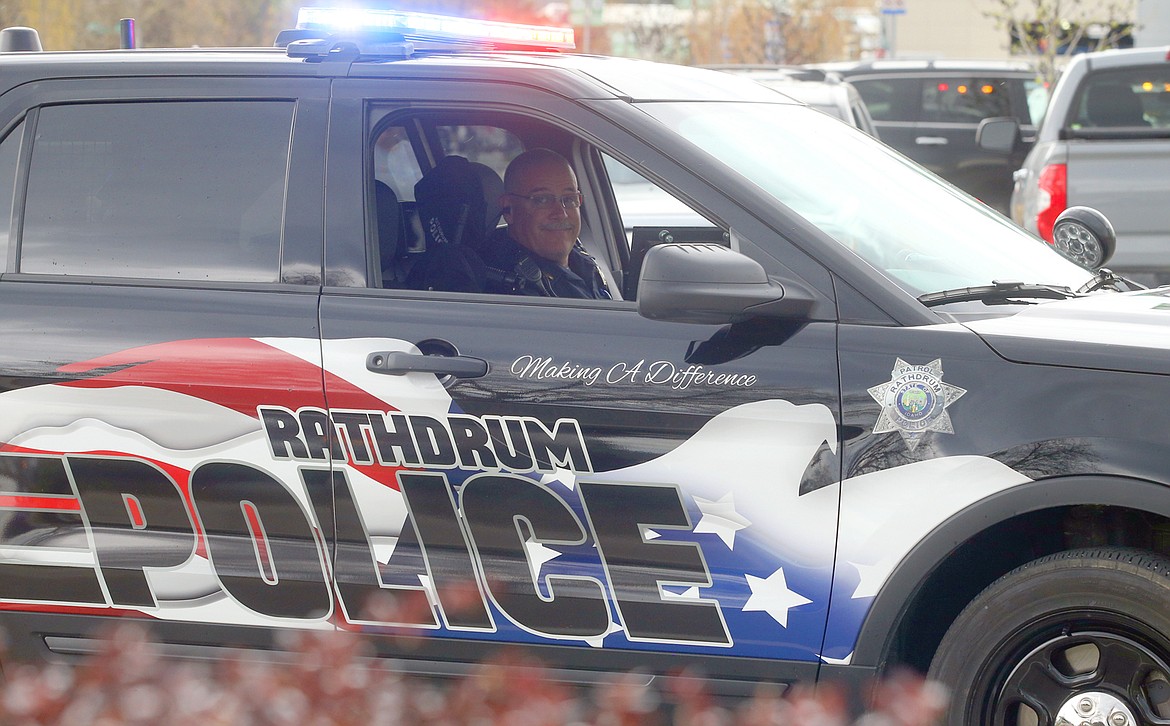 A member of the Rathdrum Police Department takes part in the “First Responder Parade of Emergency Vehicles” Wednesday.
