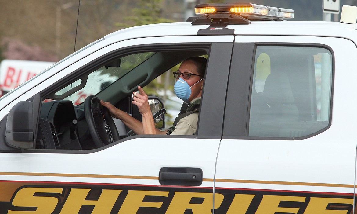 BILL BULEY/Press
A member of the Kootenai County Sheriff’s Office drives in the emergency services parade Wednesday.