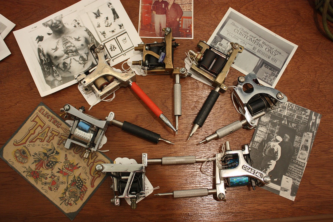 Display in progress showing vintage tattoo machines.
