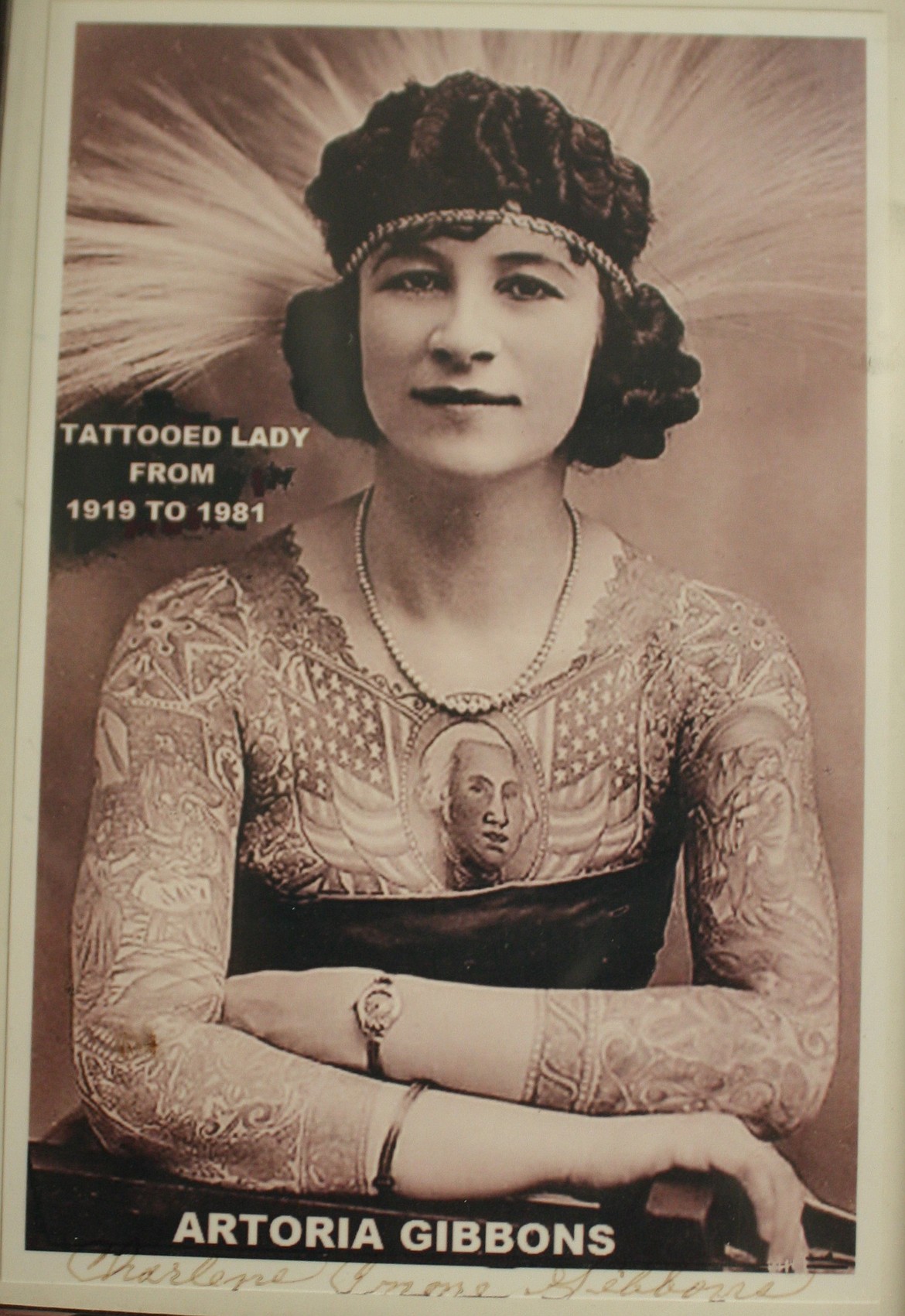 Photo of Artoria Gibbons, famous tattooed lady and tattooist from the 20th century, featured in the museum.