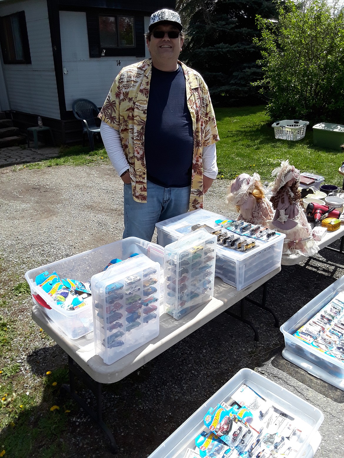 Michael Johnson of Athol said he double-checked with the city before getting permission to hold his yard sale. Johnson is selling some of his possessions to pay a few bills and help cover the cost of his wife’s cremation. The yard sale runs through Sunday. “We’re just doing what we can to survive right now,” he said.