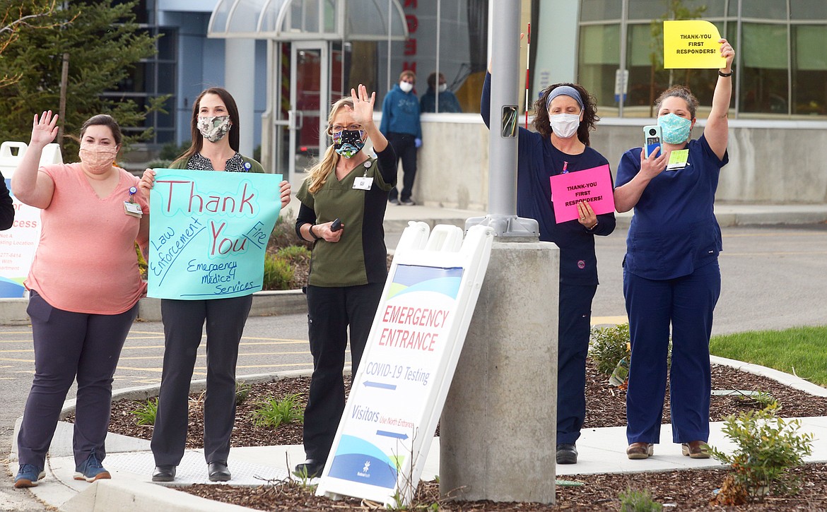 Kootenai Health staff waves to those in the “First Responder Parade of Emergency Vehicles”on April 29. While the Coeur d’Alene hospital has been ready to deal with COVID-19 victims, it has yet to treat any in its intensive care unit. And Kootenai Health has lost millions in revenue due to the pandemic.