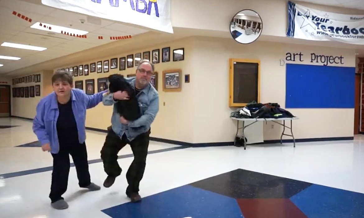 (Screenshot courtesy PAUL BONNELL/BONNERS FERRY HIGH SCHOOL)
Dawn and David Carpenter and their four-legged family member, Lily, dance to a song in one of three lip-sync videos created by Bonners Ferry High School staff to let their students know the school’s staff was thinking about them.