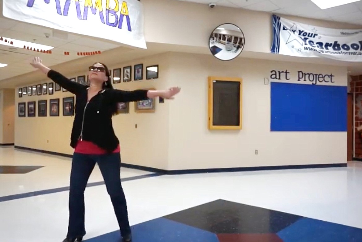 (Screenshot courtesy PAUL BONNELL/BONNERS FERRY HIGH SCHOOL)
Bonners Ferry High School principal Gina Brown performs to a ‘70s song in one of three lip-sync videos the staff created to let students know they were thinking about them.