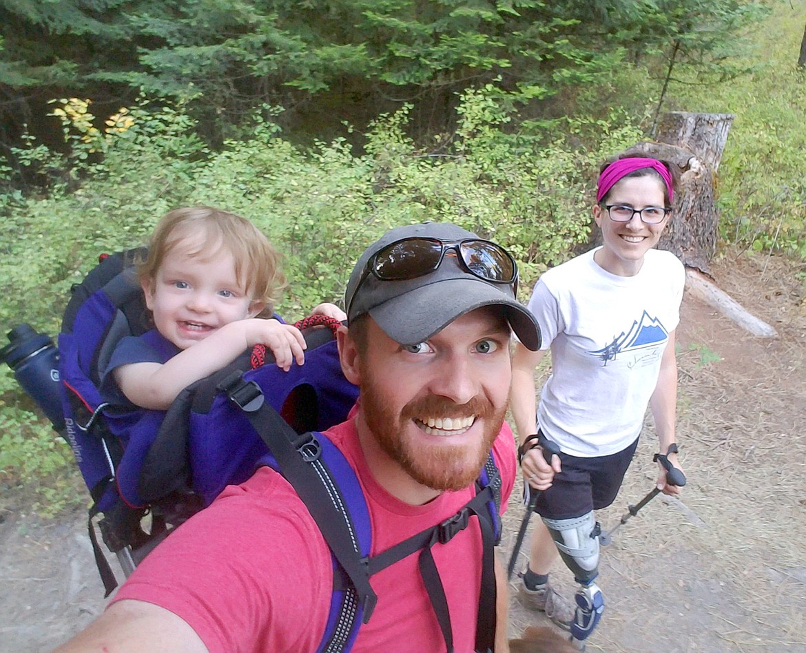 Photo courtesy 
 Jenny Gray, husband Mick Gray and son Dillon take a photo break during a hike.