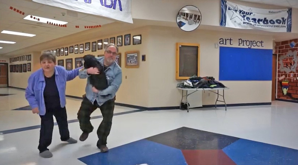 Dawn and David Carpenter and their four-legged family member, Lily, dance to a song in one of three lip-sync videos created by Bonners Ferry High School staff to let their students know the school’s staff was thinking about them.