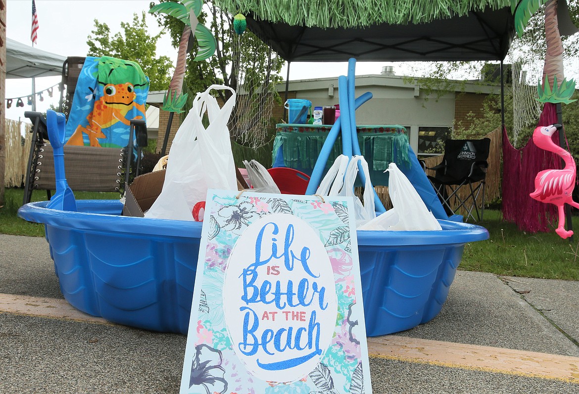 "Life is better at the beach" reads a sign in front of a food collection pool at Mullan Trail Elementary on Friday. The school held the event at the end of its spirit week, in which students have been participating through photos and videos since the school is closed because of coronavirus shutdowns. (DEVIN WEEKS/Press)