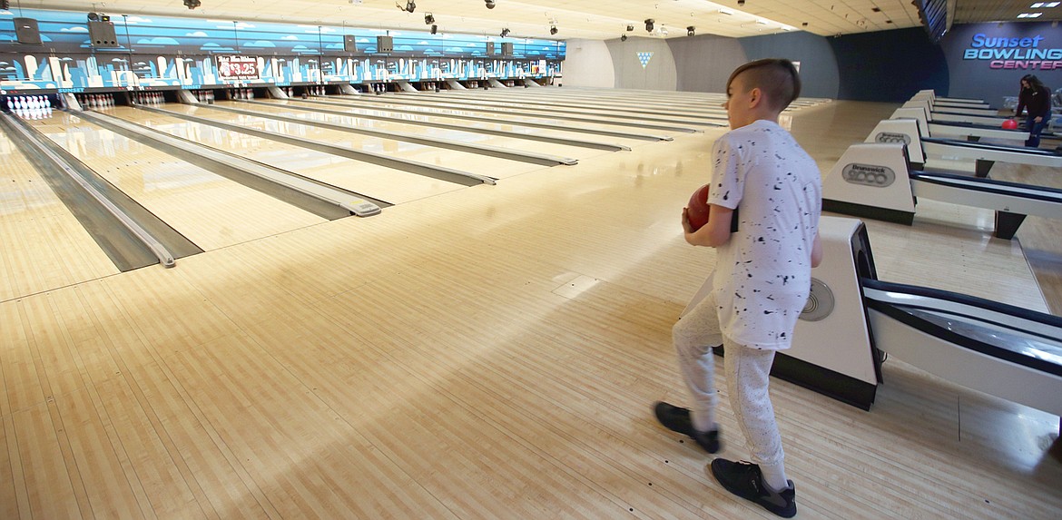 BILL BULEY/Press 
 Brayden Martinez prepares to send the ball down a lane at Sunset Bowling Center in Coeur d'Alene on Friday.