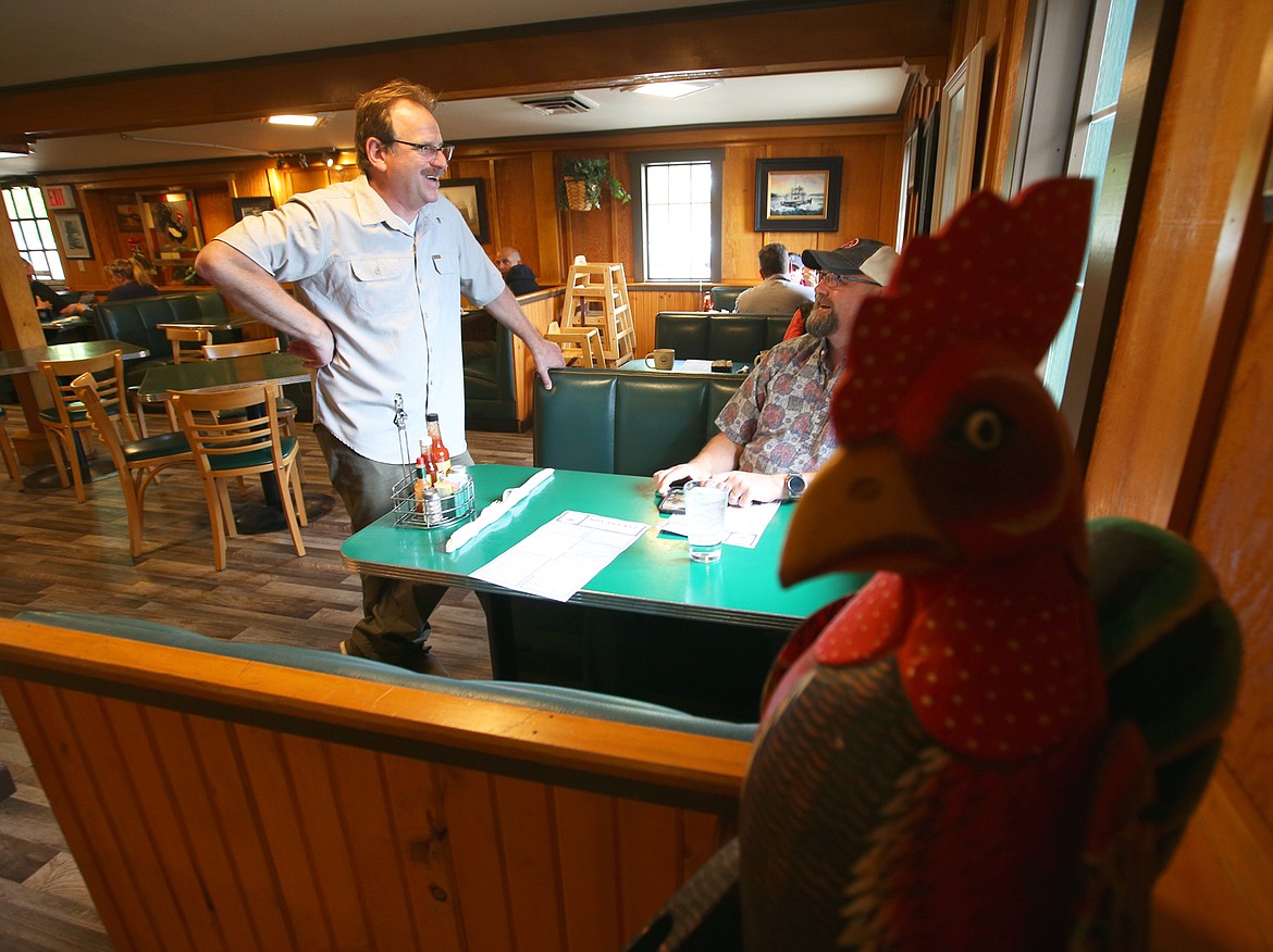 BILL BULEY/Press 
 Michael DePasquale, owner of Michael D's Eatery in Coeur d'Alene, chats with a customer Saturday morning.