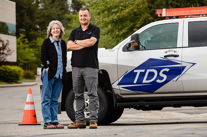 Anita Parisot, left, the field marketing manager for TDS in Coeur d’Alene, and Josh Ferguson, a field service supervisor for TDS, are both longtime residents of the area who were hired by the telecommunications company.