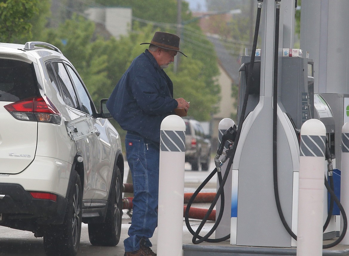 Gas prices are headed back up around the country and in North Idaho. Here, a customer stops at a gas station on Northwest Boulevard on Monday.