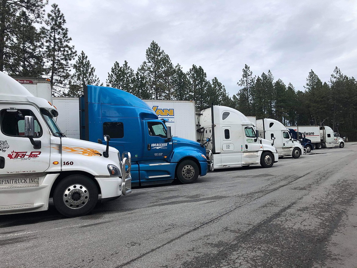 (Photo courtesy KENDRA DODGE) 
 A few of the trucks at a rest stop where volunteers put together a meal for truckers to thank them for being COVID-19 superstars and helping keep the stores full.