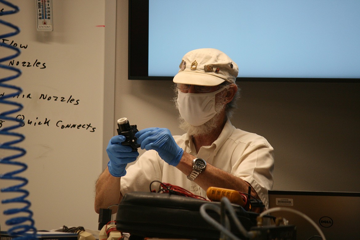 Cheryl Schweizer/Columbia Basin Herald 
  
 Wearing protective equipment, Big Bend Communty College workforce education instructor James Ayers teaches a class Wednesday morning.