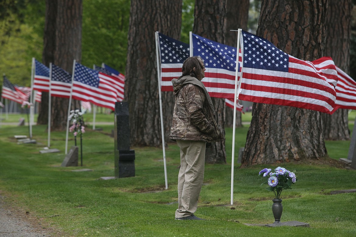 Lois Tucker visits Evergreen Cemetery Friday to pay respects to her mom.