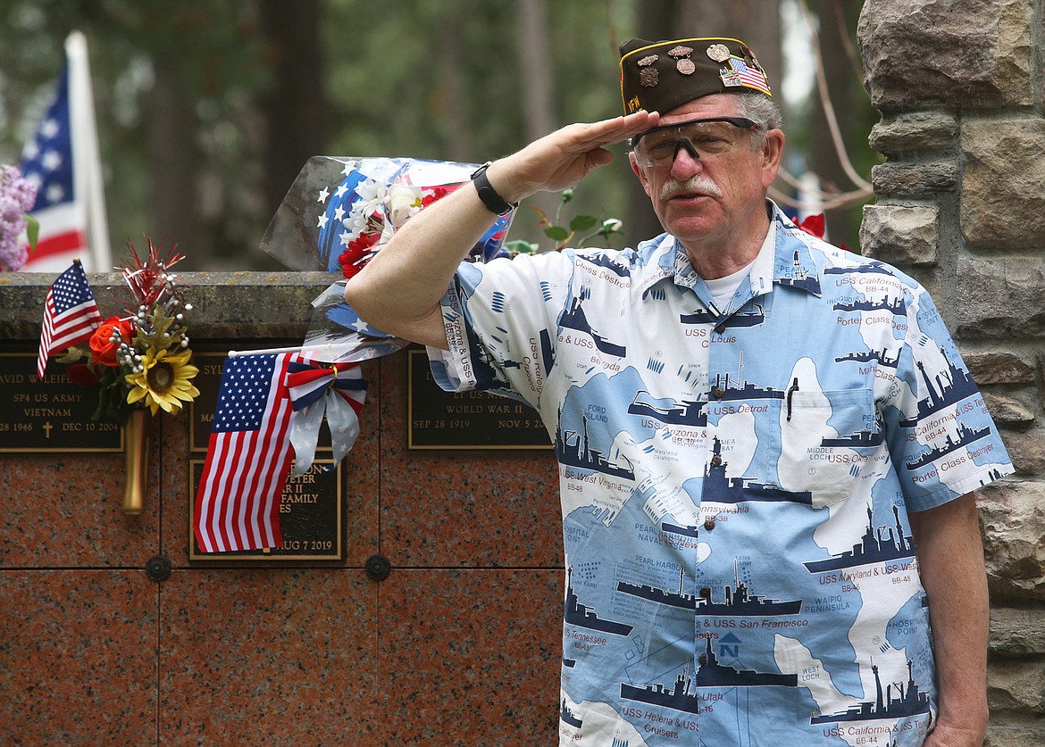 BILL BULEY/Press 
 Robert Shay salutes during Monday's Memorial Day ceremony at Evergreen Cemetery.