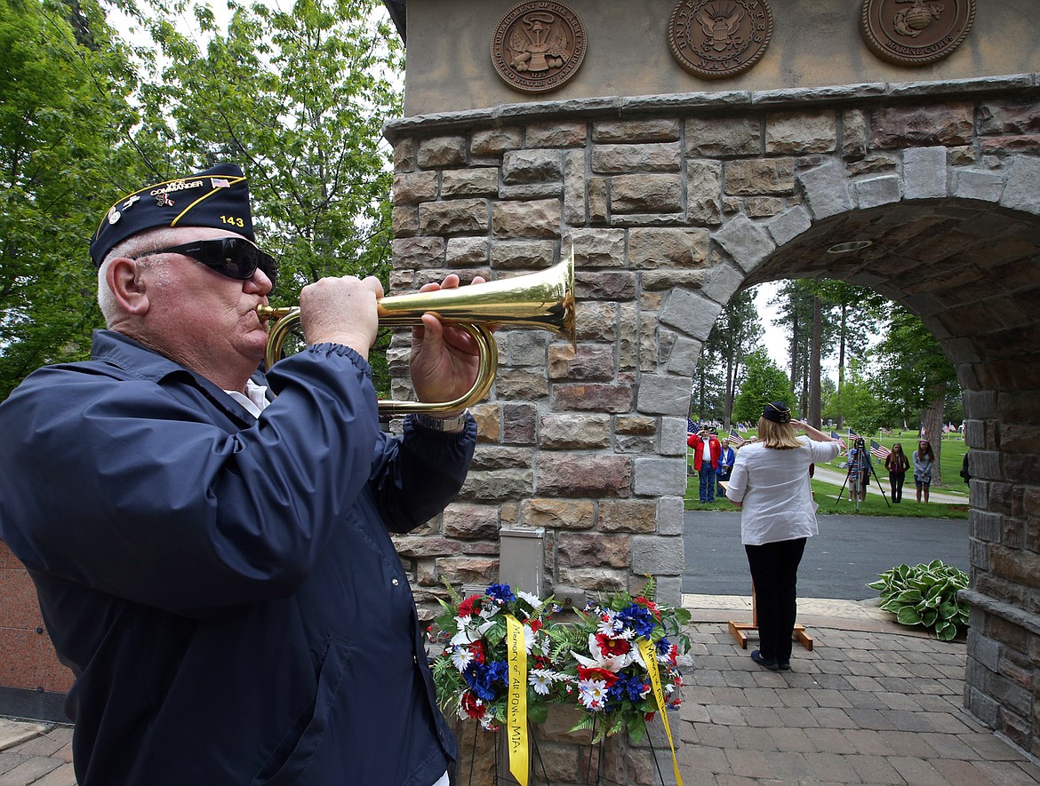 James Culpepper plays “taps” during Monday’s Memorial Day ceremony at Evergreen Cemetery.
