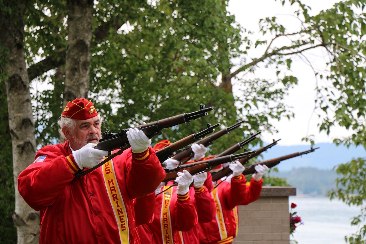 (Photo by CAROLINE LOBSINGER) 
 Members of the Marine Corps League deliver a 21-gun salute in honor of those who died in service to the country at Monday's Memorial Day tribute at Lakeview Cemetery in Sandpoint.