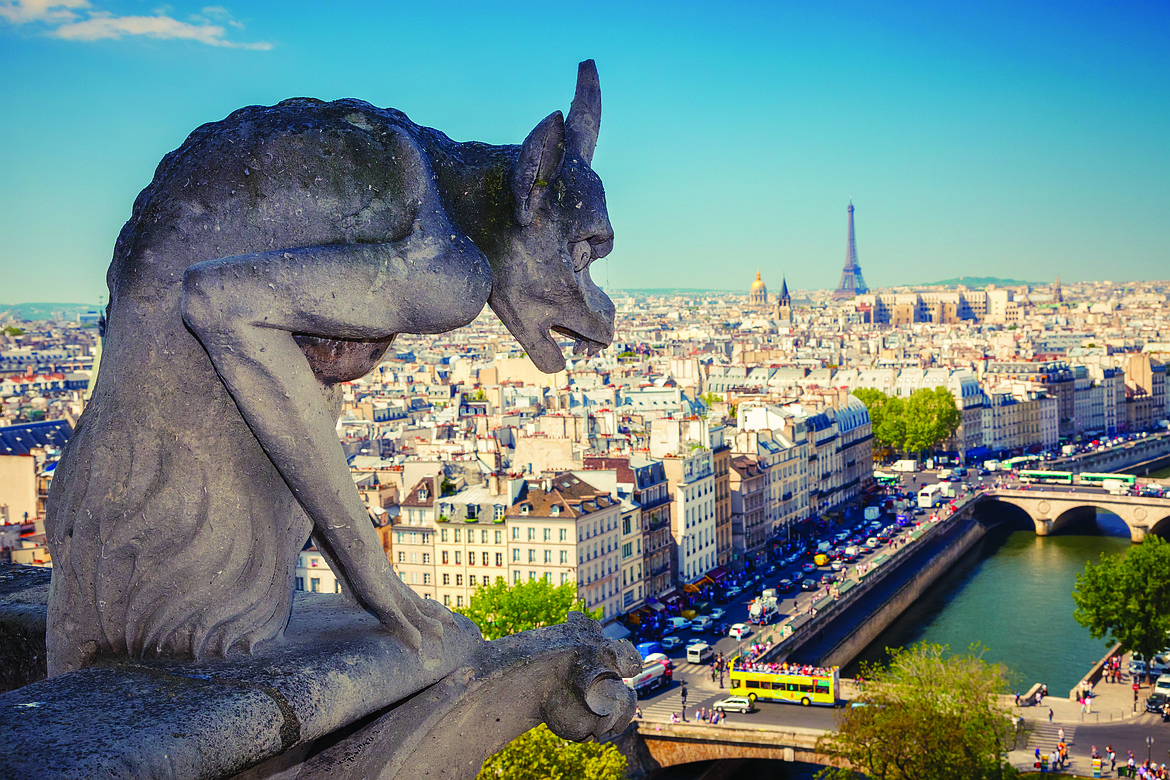 SHUTTERSTOCK INC. 
 Ugly but benevolent gargoyle on Notre Dame Cathedral in Paris, France.