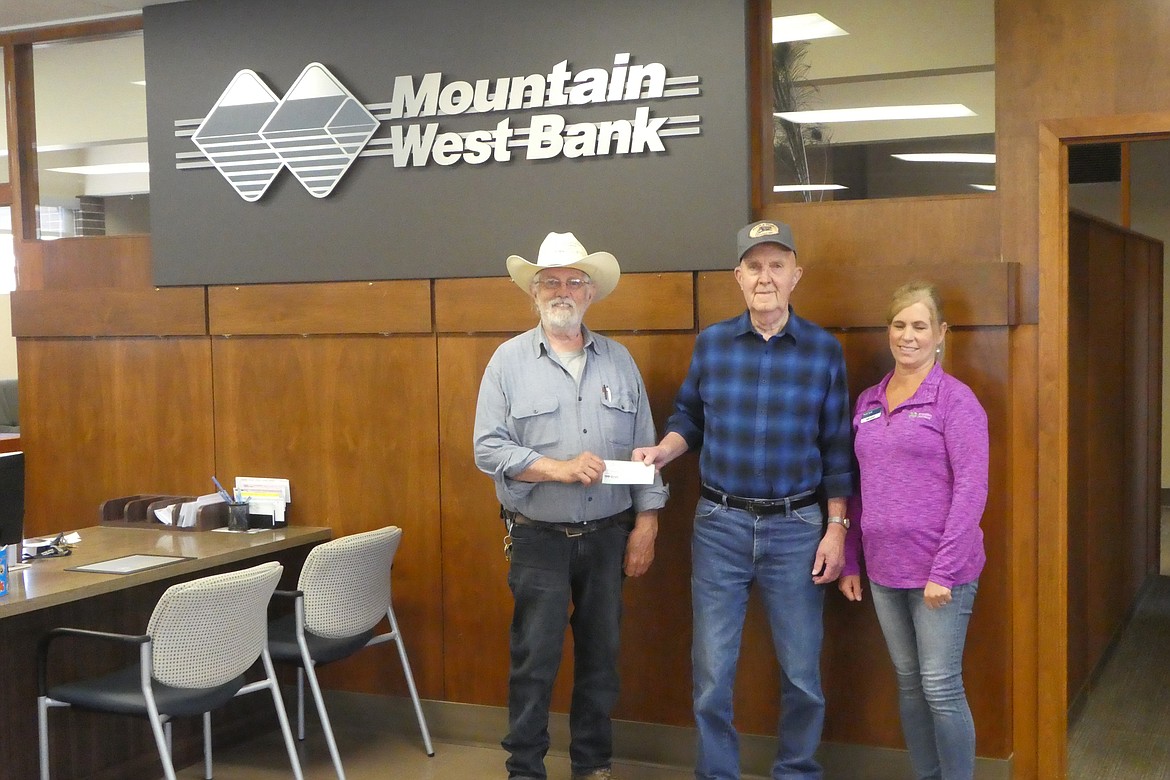 Longtime Moyie Springs resident Bob Pluid, center, donates $30,000 for the waterline replacement in the old Grandview Cemetery. Also pictured: volunteer Jim Thompson and Patti Solt of Mountain West Bank. The cemetery board has agreed to make up the difference so the goal has been met and construction will begin in the near future. Kudos to the many people who have donated materials and given financially to make this happen.