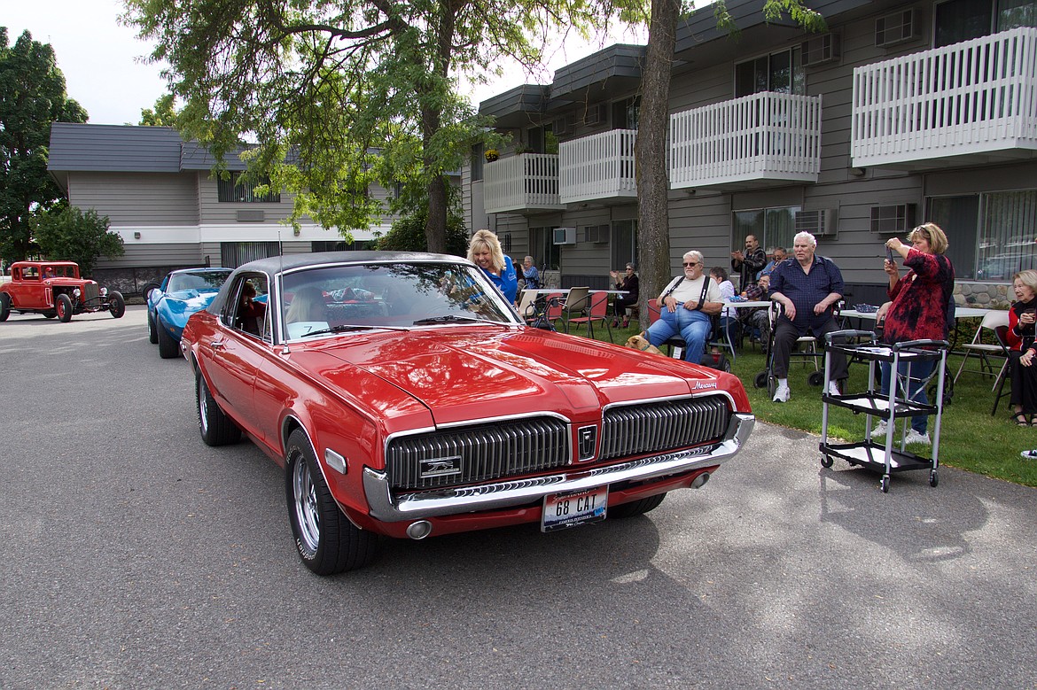 Dana Klass, executive director of Bestland of Coeur d'Alene, visits with members of Silver Angels for the Elderly as residents enjoy the classic car cruise last fall. Silver Angels is conducting a classic car cruise for six senior living facilities on Saturday. (Courtesy photo)