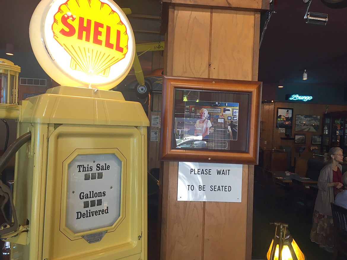 BILL BULEY/Press 
 A decorative Shell gas pump greets guests inside the Iron Horse Bar & Grill.