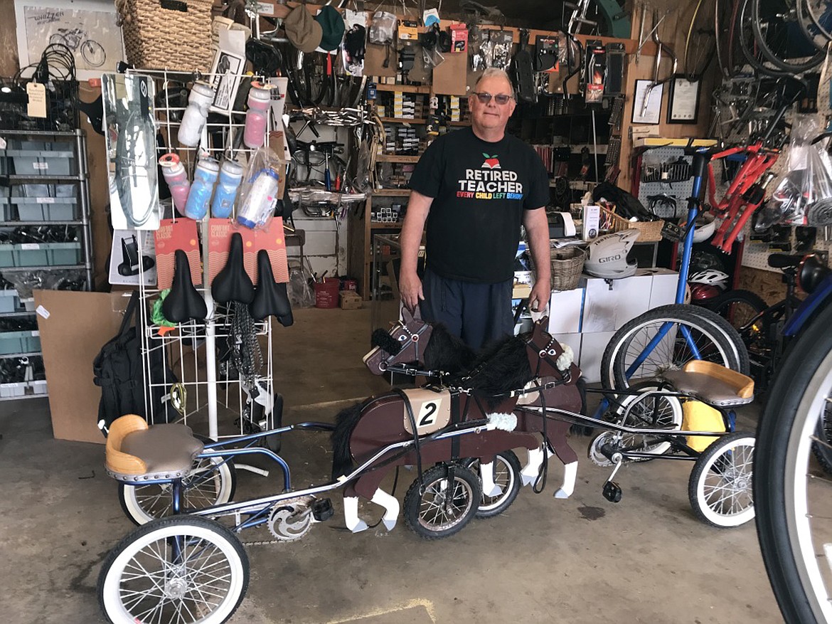 Dick Ross, who works part-time at Bonner County Bicycles, last week repaired two custom-made (by the Amish) three-wheeler bikes for children with ponies leading the way.