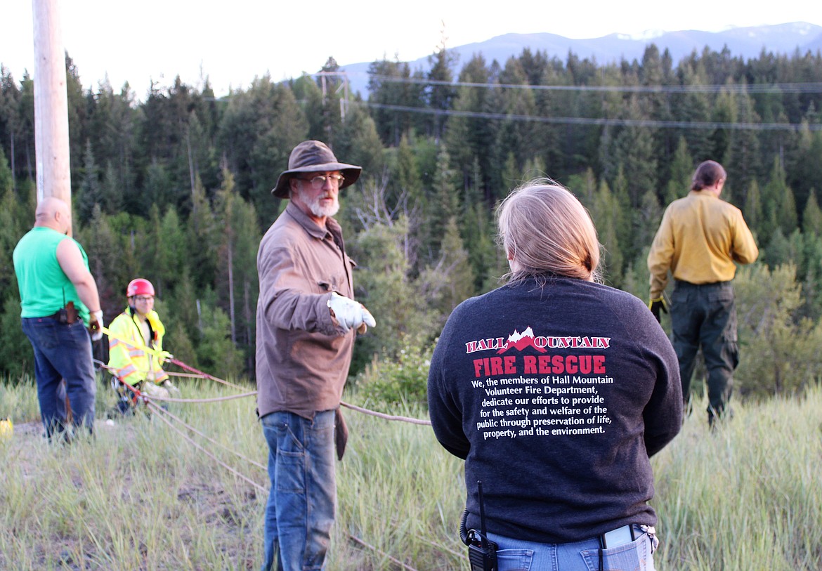 Training opportunities are vital to keeping skills sharp. Hall Mountain Volunteer Fire Department Firefighters practiced a rescue using ropes and a stretcher this past Thursday near Rock Creek. Pictured, from left, are Ron Hanner, Matt Cossalman, Andy Durette, Sandy Steinhagen and Wallace Nyberg.