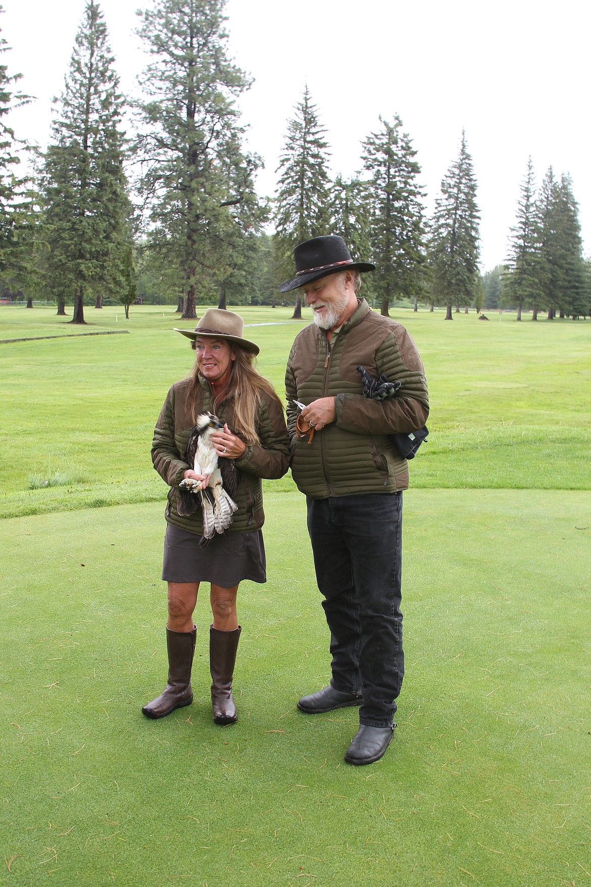 (Photo by KEITH KINNAIRD) 
 Jane and Don Veltkamp prepare to release the osprey at the Elks Lodge Golf Course on Sunday.