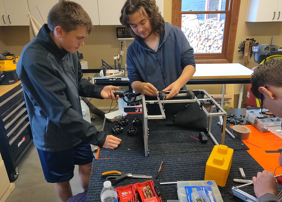 Nathan Bossé, center, and teammate Luke Robert work on a project last October. Nathan was recently named the first Idaho student to receive the prestigious FIRST (For Inspiration and Recognition of Science and Technology) Tech Challenge Dean's List Award since the award was created in 2010. He was one of 10 winners from around the world. (Courtesy photo)