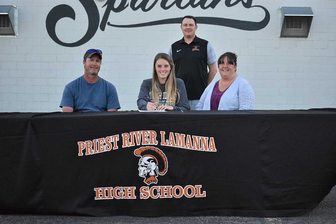 Maddy Rusho celebrates her commitment to play golf at North Idaho College last Thursday in the Priest River High School parking lot. Pictured in the front row (from left): Maddy’s dad, Keith, Maddy and her mom, Tracy. Back: Athletic Director Matt George.