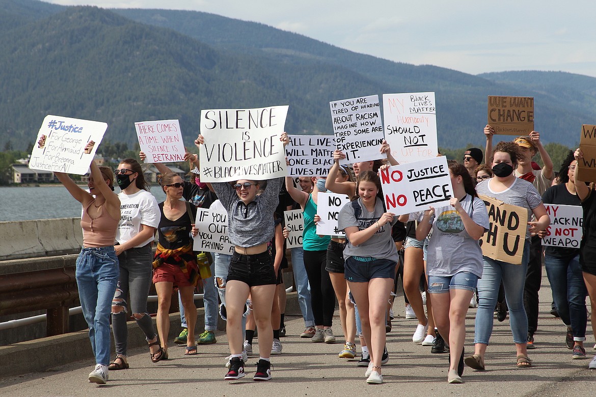 (Photo by KEITH KINNAIRD) 
 Protesters received honks of support, but were also jeered by some.